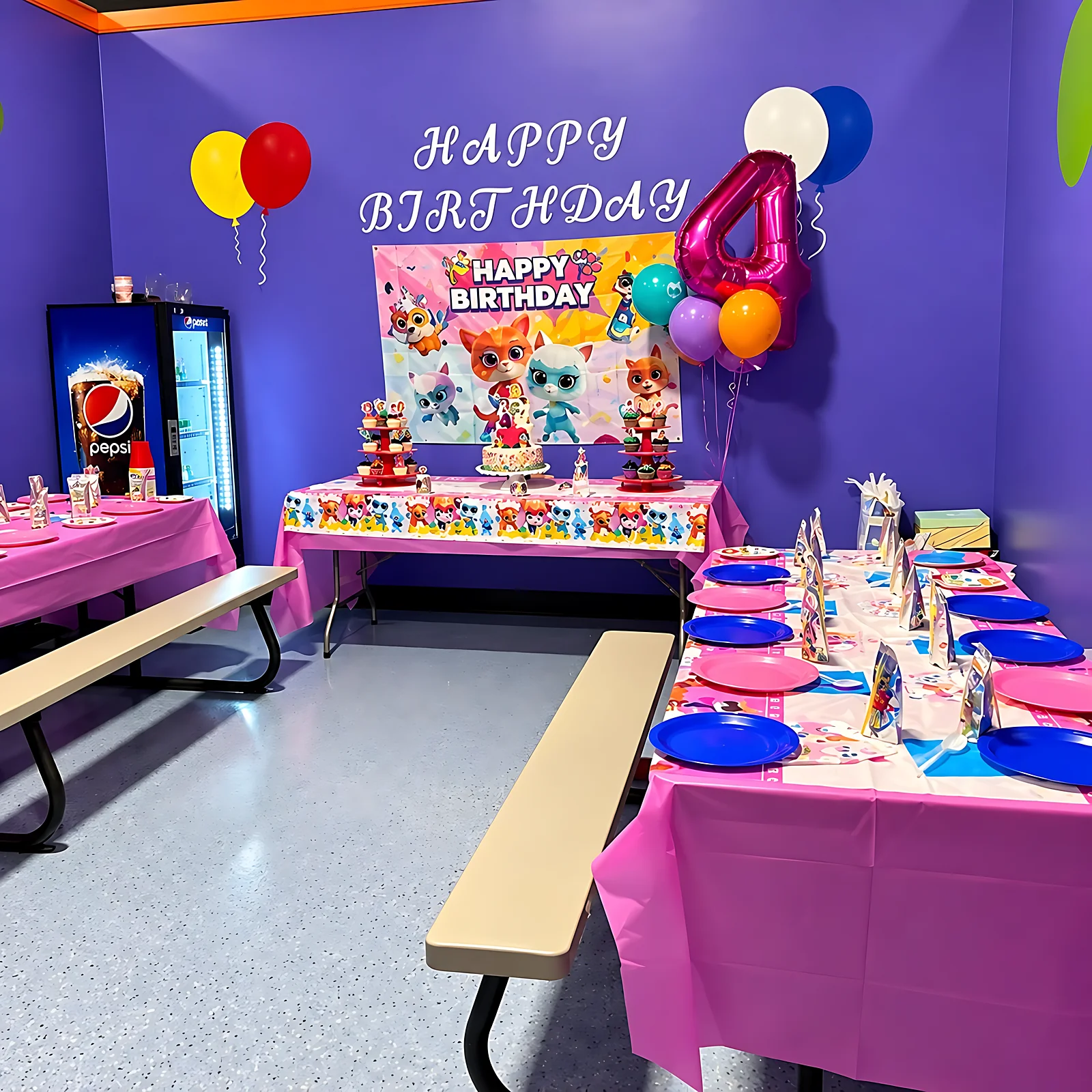 Birthday party table set up with decorations and balloons